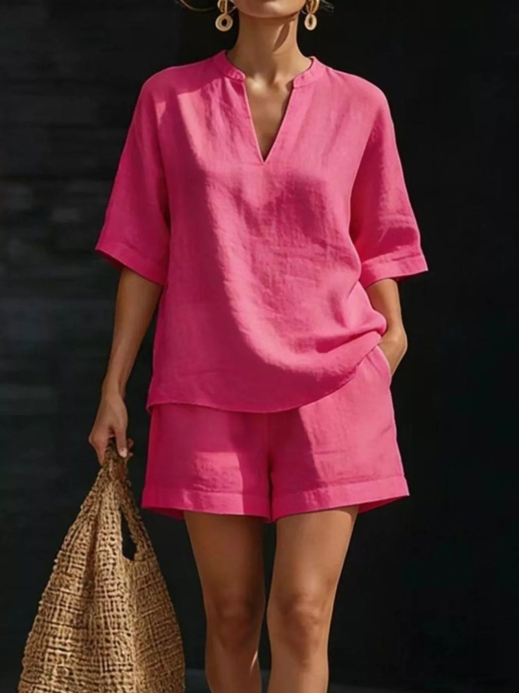 Plus size notched half sleeve top and shorts set by Trendsi, featuring a stylish coordinated look in a full size.