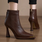 Women’s pointed-toe chunky-heel side-zip boots by Plush Fashion Hub, showcasing sleek black leather with stylish design details.