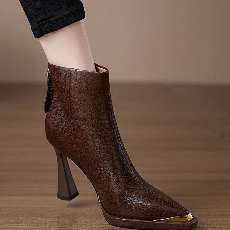 Women's pointed-toe chunky-heel side-zip boots by FitiqueFit, showcasing sleek leather design with side zipper and sturdy heel.