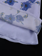 Floral puff sleeve mini dress by Shopimist featuring a feminine fit, vibrant flower pattern, and short puffed sleeves.