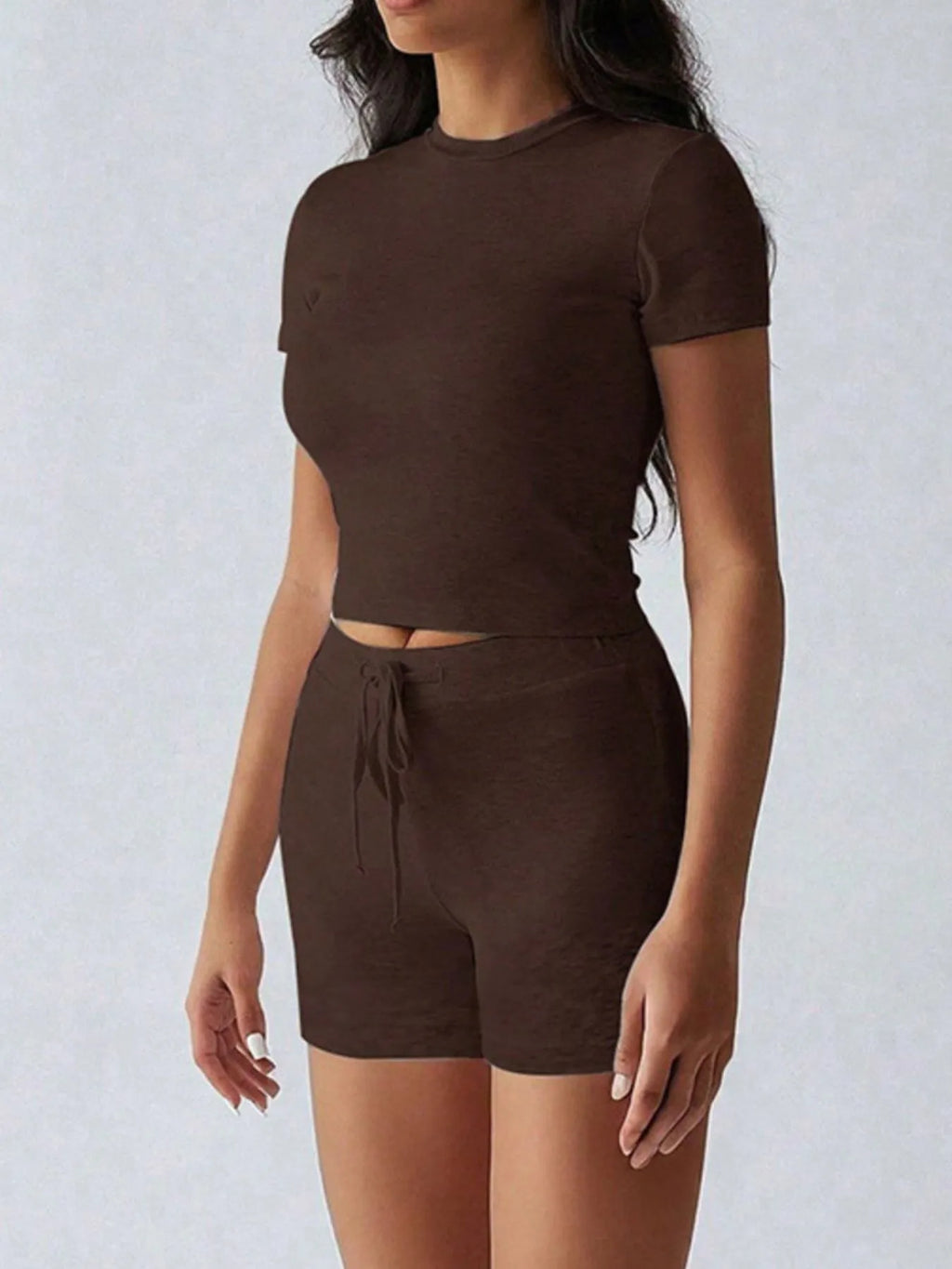 Trendsi activewear set with round neck short sleeve top and matching shorts, lightweight and comfortable for exercise or casual wear.