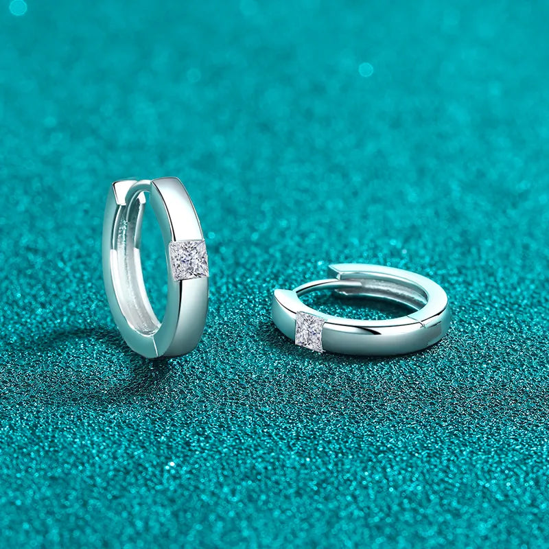 925 Sterling Silver Moissanite Huggie Earrings featuring sparkling gemstone accents in a close-up view