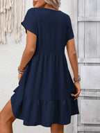 Women's casual V-neck mini dress with ruffle hem and ruched details, stylish and comfortable from Trendsi.