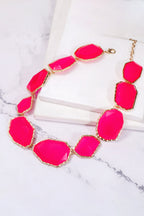 Zinc alloy necklace with geometrical resin pendant, featuring modern design and metallic frame, stylish jewelry accessory.