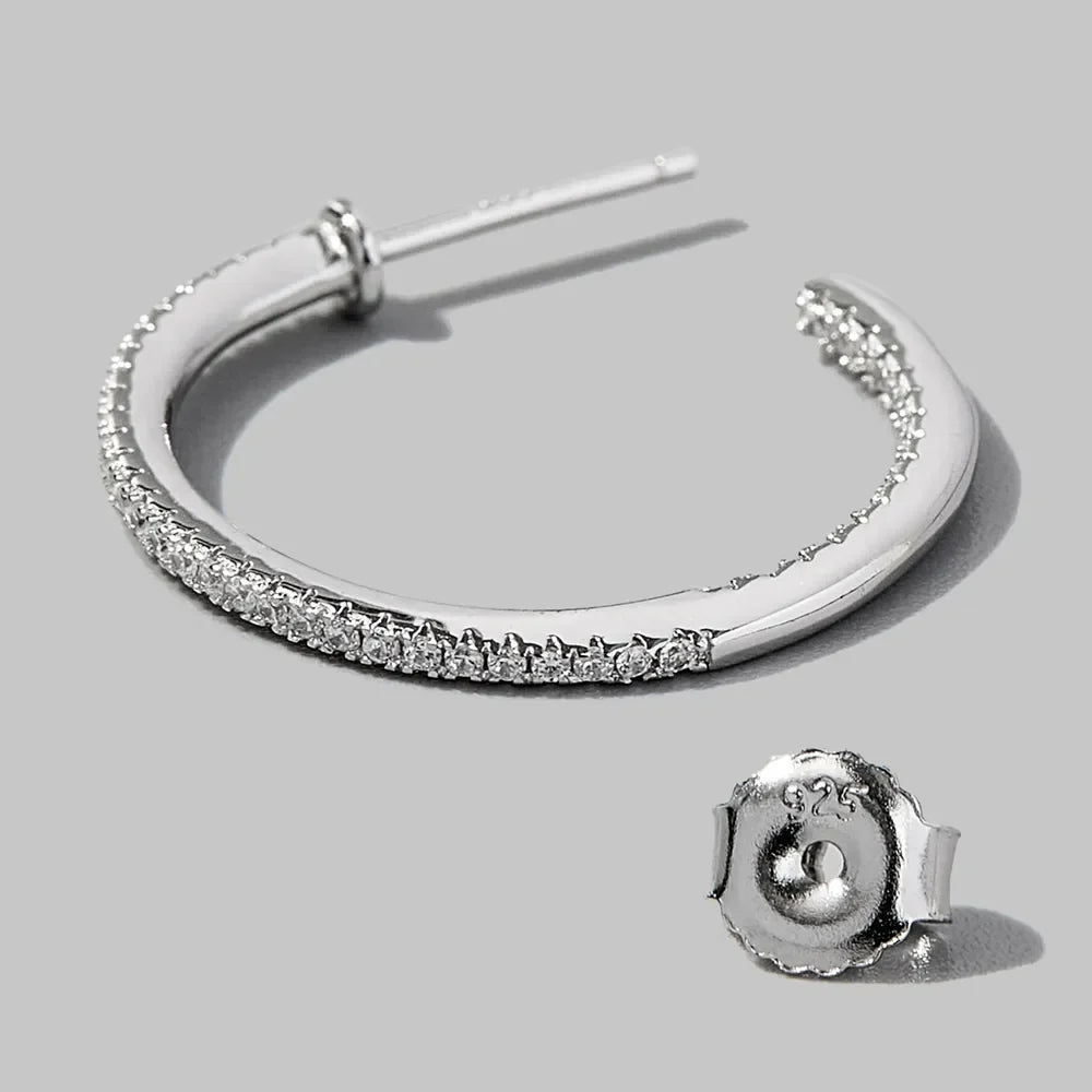 Sterling silver zircon C-hoop earrings with a polished finish, stylish jewelry accessory for women.