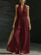 V-neck halter neck jumpsuit for women by Plush Fashion Hub, showcasing the stylish design and fit of the one-piece outfit.