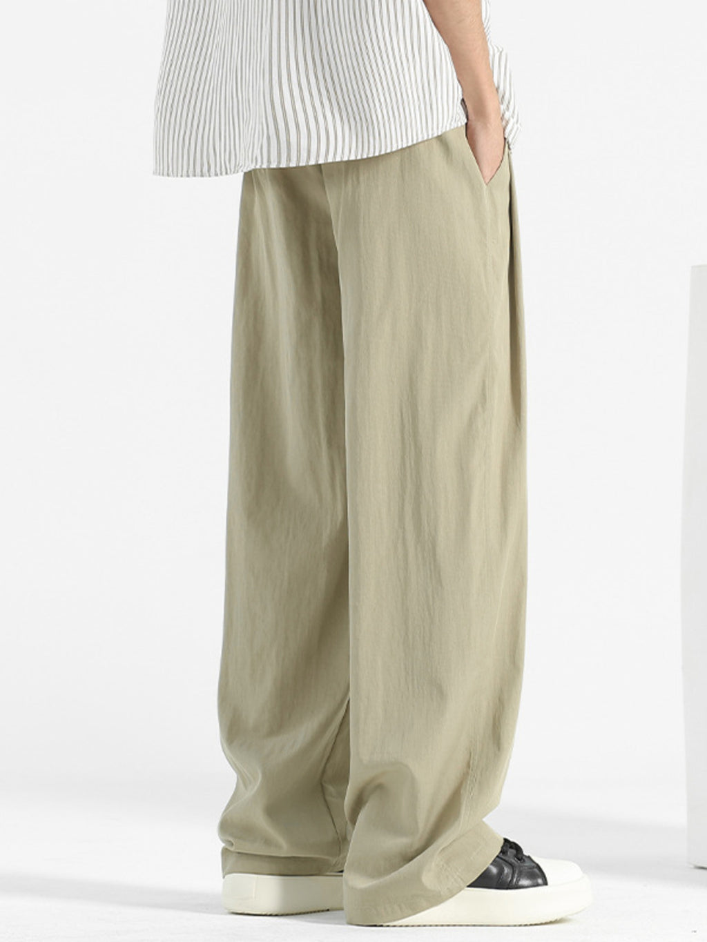 Men's loose fit casual pants with drawstring waist, relaxed comfort trousers in neutral fabric, by Trendsi.