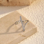 Irregular rhinestone ring from Shopimist featuring a unique, asymmetrical design with sparkling rhinestones on a silver band.