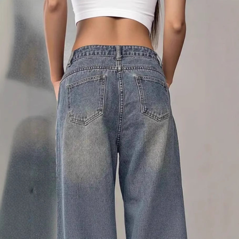 European and American women's washed vintage denim pants with a classic fit and distressed details, styled with casual footwear.