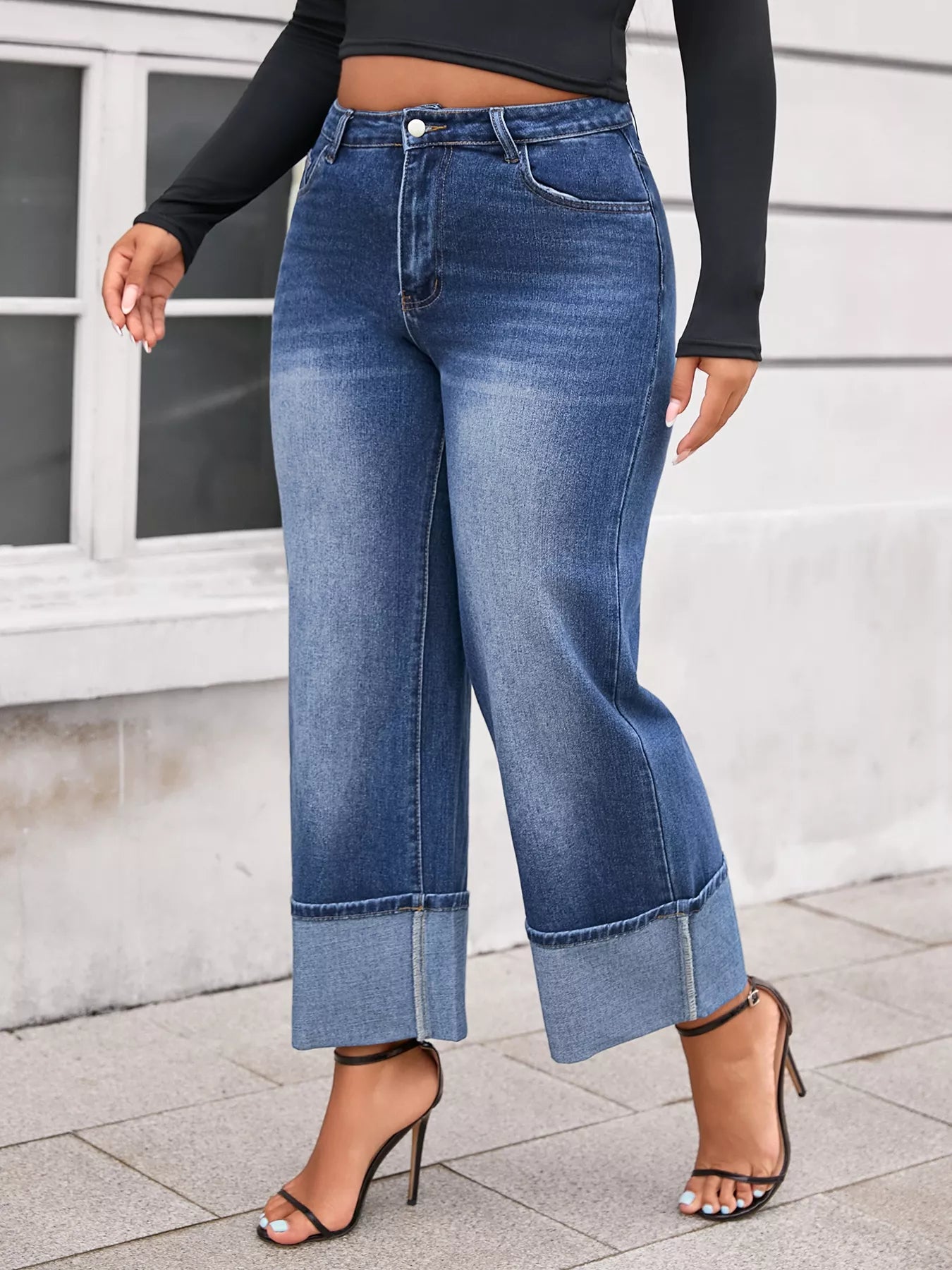 Plus size high waist cuffed wide leg jeans from Shopimist, showing the denim with folded cuffs and relaxed fit.