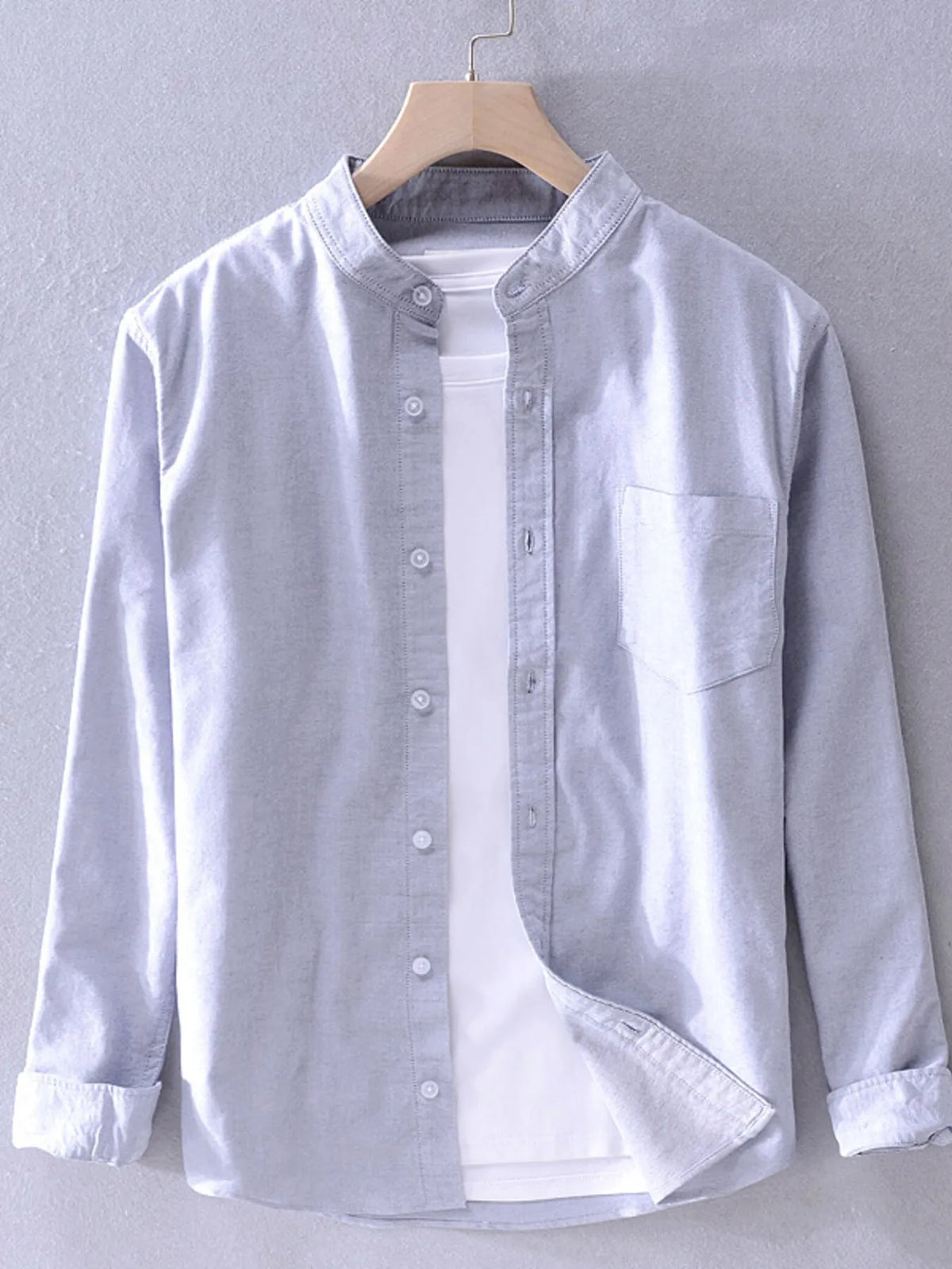 Men's plus size long sleeve button-up shirt by Trendsi, shown in dark fabric with a classic collar and front buttons.