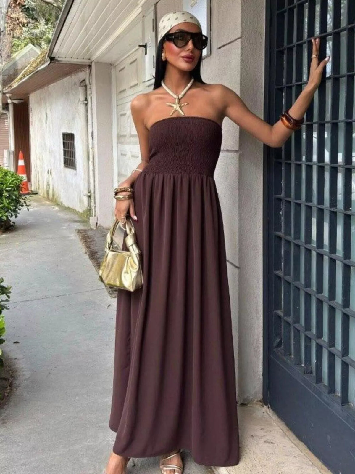 Plush Fashion Hub strapless smocked maxi dress in light fabric, featuring a fitted bodice and flowing skirt for a stylish look.