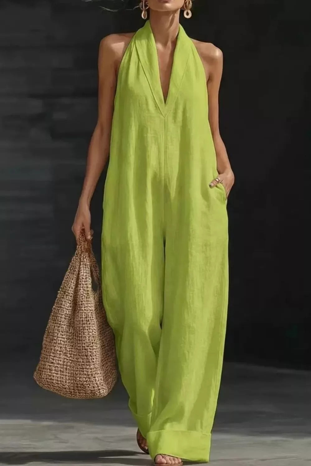 Women's sleeveless wide-leg jumpsuit with pockets, casual trendy romper by Trendsi, shown in a chic, relaxed fit.