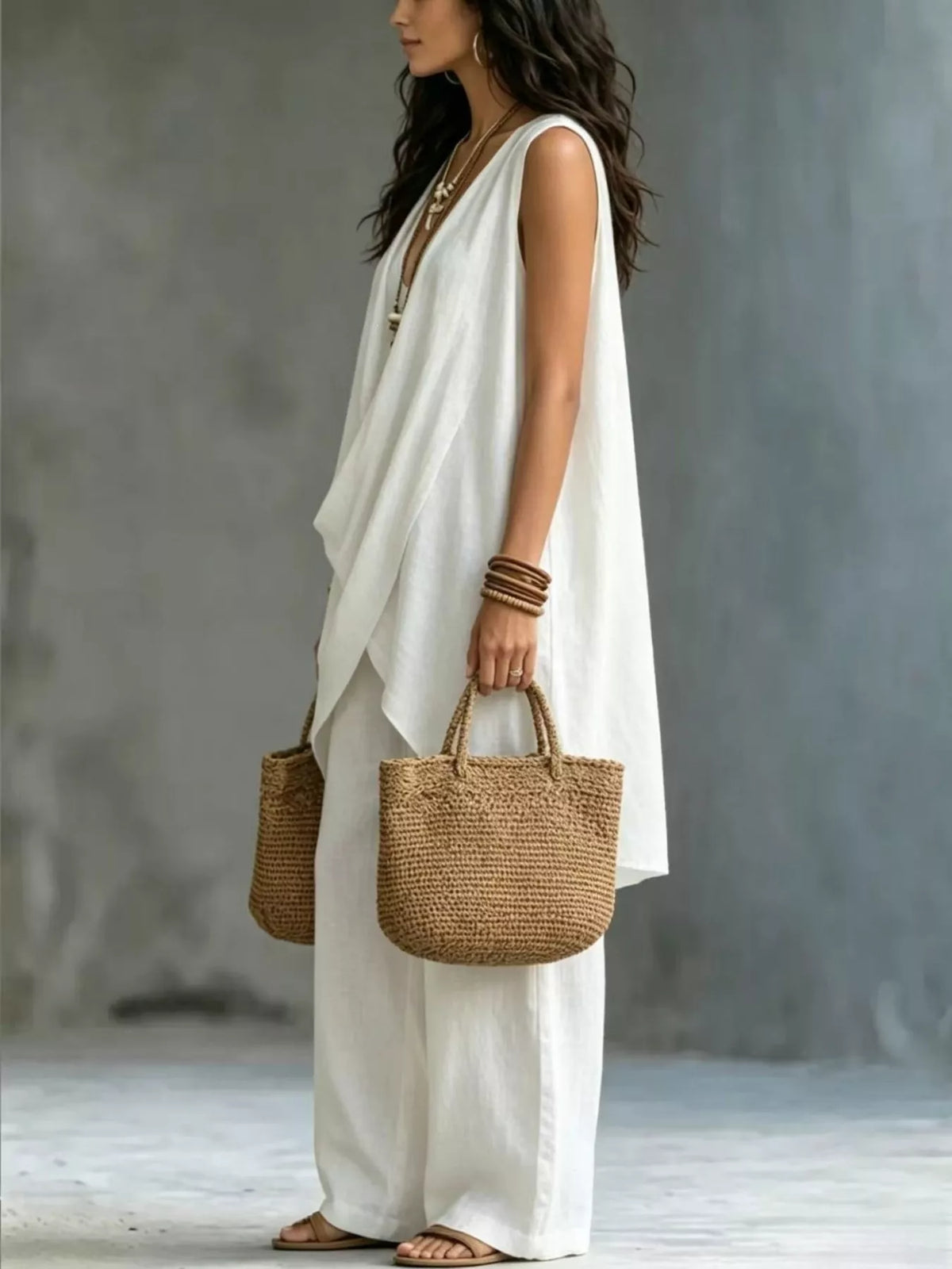 Plush Fashion Hub sleeveless asymmetrical top and wide-leg pants set, featuring modern design and comfortable fit.