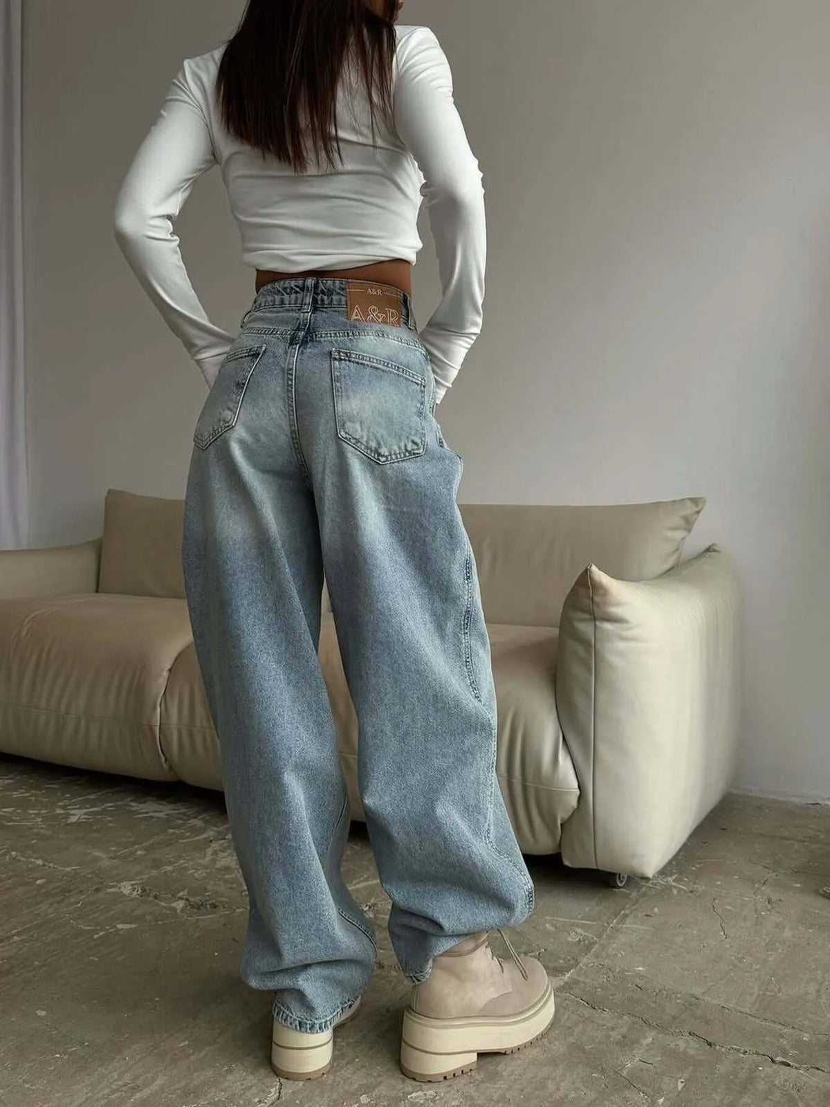 Plush Fashion Hub wide-leg denim jeans displayed on a model, showcasing the relaxed fit and stylish design.