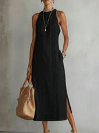 Plush Fashion Hub sleeveless hollow-out midi dress with side slit and pockets, showcasing a stylish, modern design.