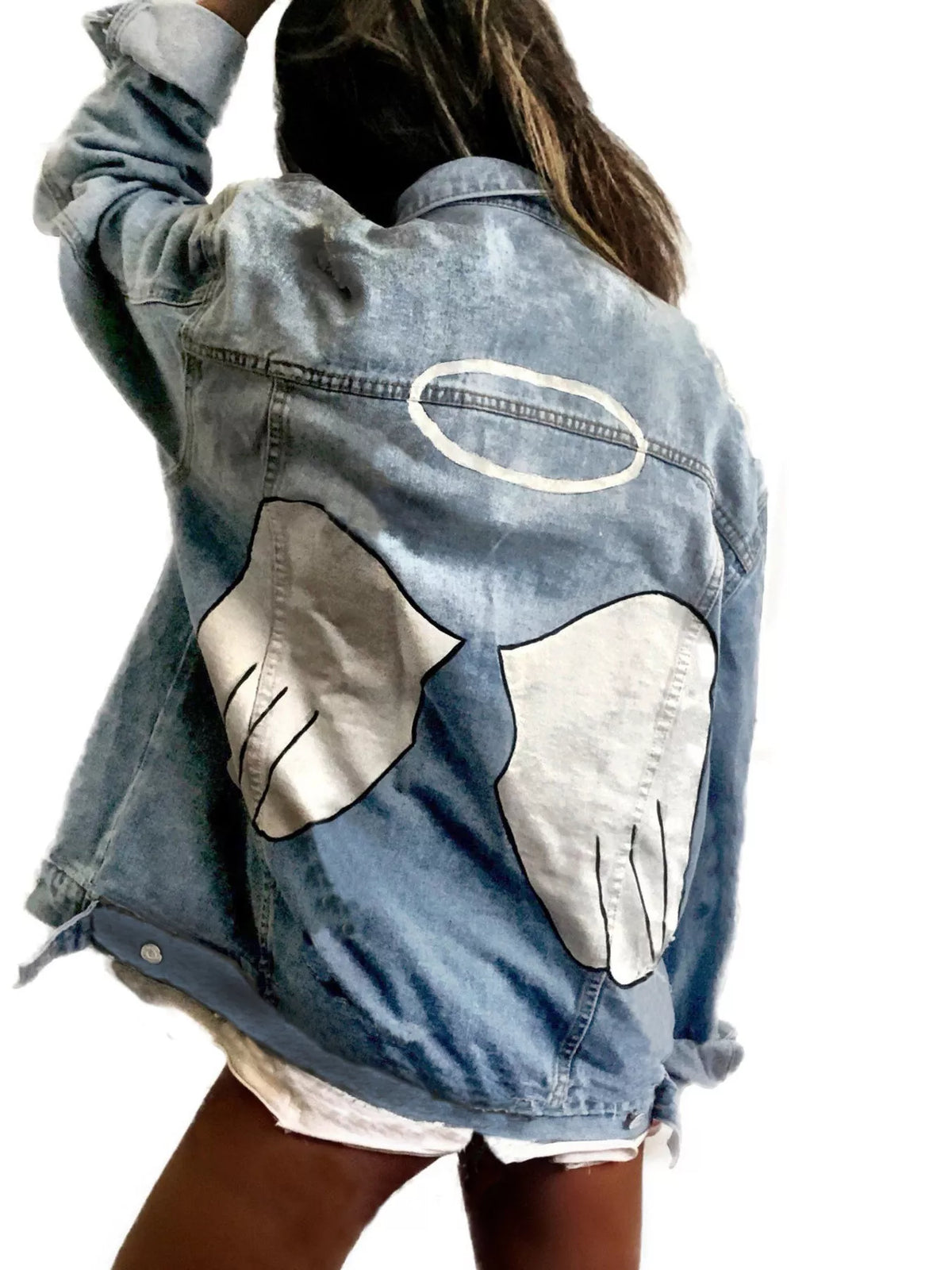 Plus size denim jacket with angel wings graphic back design, trendy full-size fashion piece by Trendsi