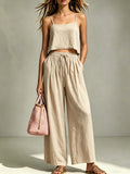 Women's camisole and wide-leg pants two-piece set by Plush Fashion Hub, casual summer outfit, featuring a sleeveless top and flowy pants.