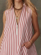 Striped zipper neck ruffle hem dress by Shopimist, featuring a stylish neckline and flowy hem detail in a vibrant pattern.