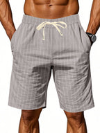 Men's plus size striped casual shorts with drawstring waist from Trendsi, shown in a full-length view.