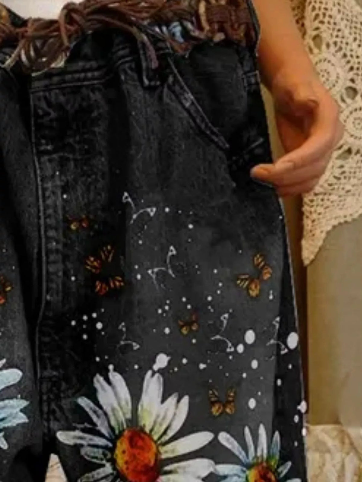 Full size floral distressed cropped jeans by Trendsi, showing distressed details, floral embroidery, and a relaxed fit.