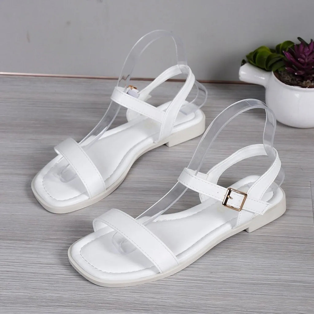 Women's open toe flat sandals by Trendsi featuring comfortable PU leather slide shoes with a chic, stylish design.