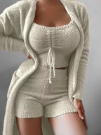 Plus size cozy plush top, shorts, and cardigan set by Trendsi, featuring soft, comfortable loungewear for relaxed styling