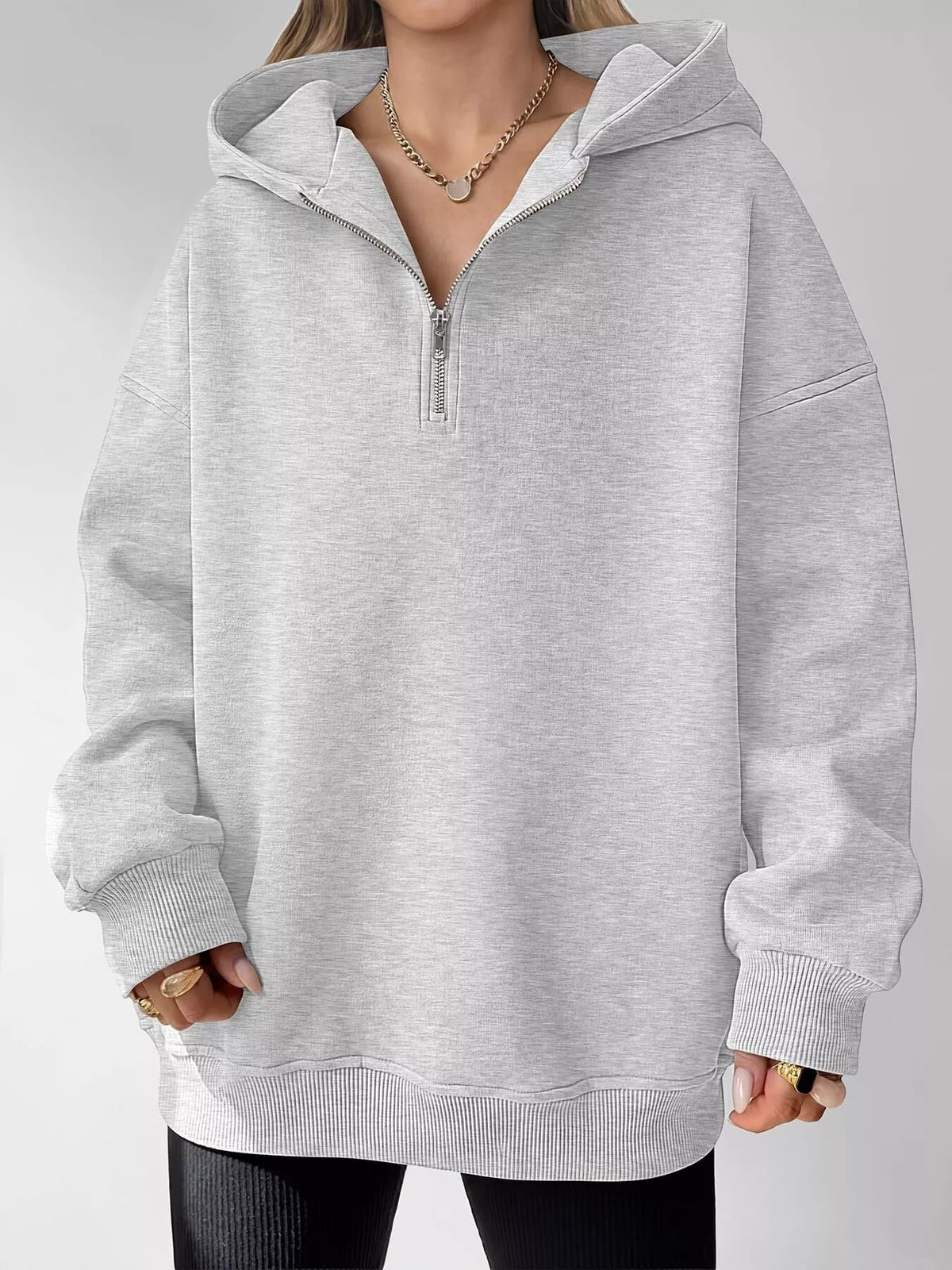 Oversized quarter-zip hoodie by Trendsi, casual tops in soft fabric with a relaxed fit and front quarter-zip closure.