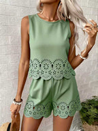 Women's elegant hollow-out floral top and pants set by FitiqueFit, casualwear with intricate floral cutout details and stylish fit.