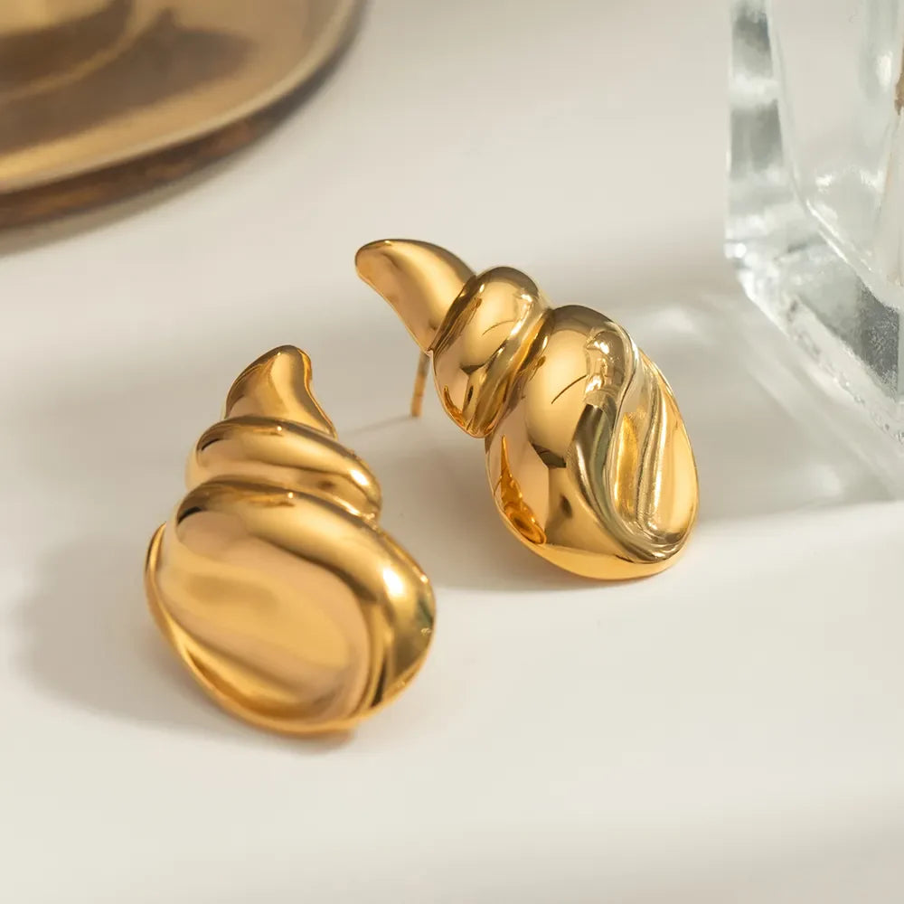 18K gold-plated conch earrings by Plush Fashion Hub featuring detailed shell design on shiny metal hooks.
