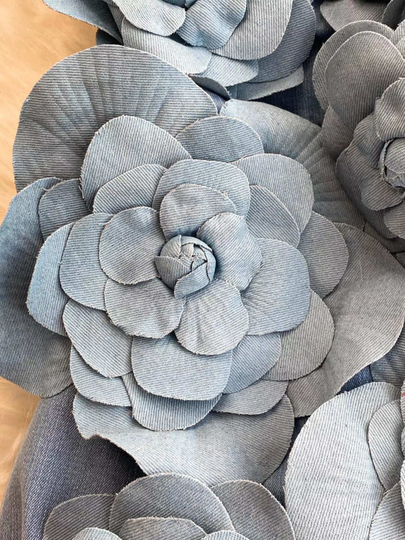 Floral applique strapless denim dress from Trendsi featuring a fitted bodice and decorative floral details.