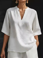 Plus size notched half sleeve top and shorts set by Trendsi, with a stylish casual look, shown in natural fabric and color.