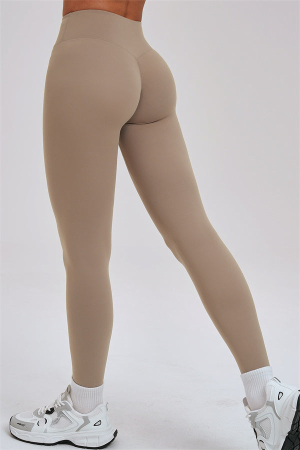 Fitglutes activewear three-piece set including a kinetic zip jacket, cross-back sports bra, and leggings for workout comfort.
