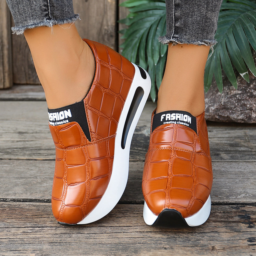 Women's crocodile pattern faux leather platform slip-on sneakers with casual style and trendy design by Trendsi.