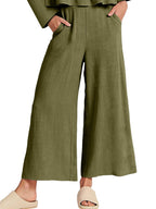 Women's ruffled hem long sleeve top and pants lounge set with pockets, trendy 2-piece set by Trendsi, comfortable and stylish.