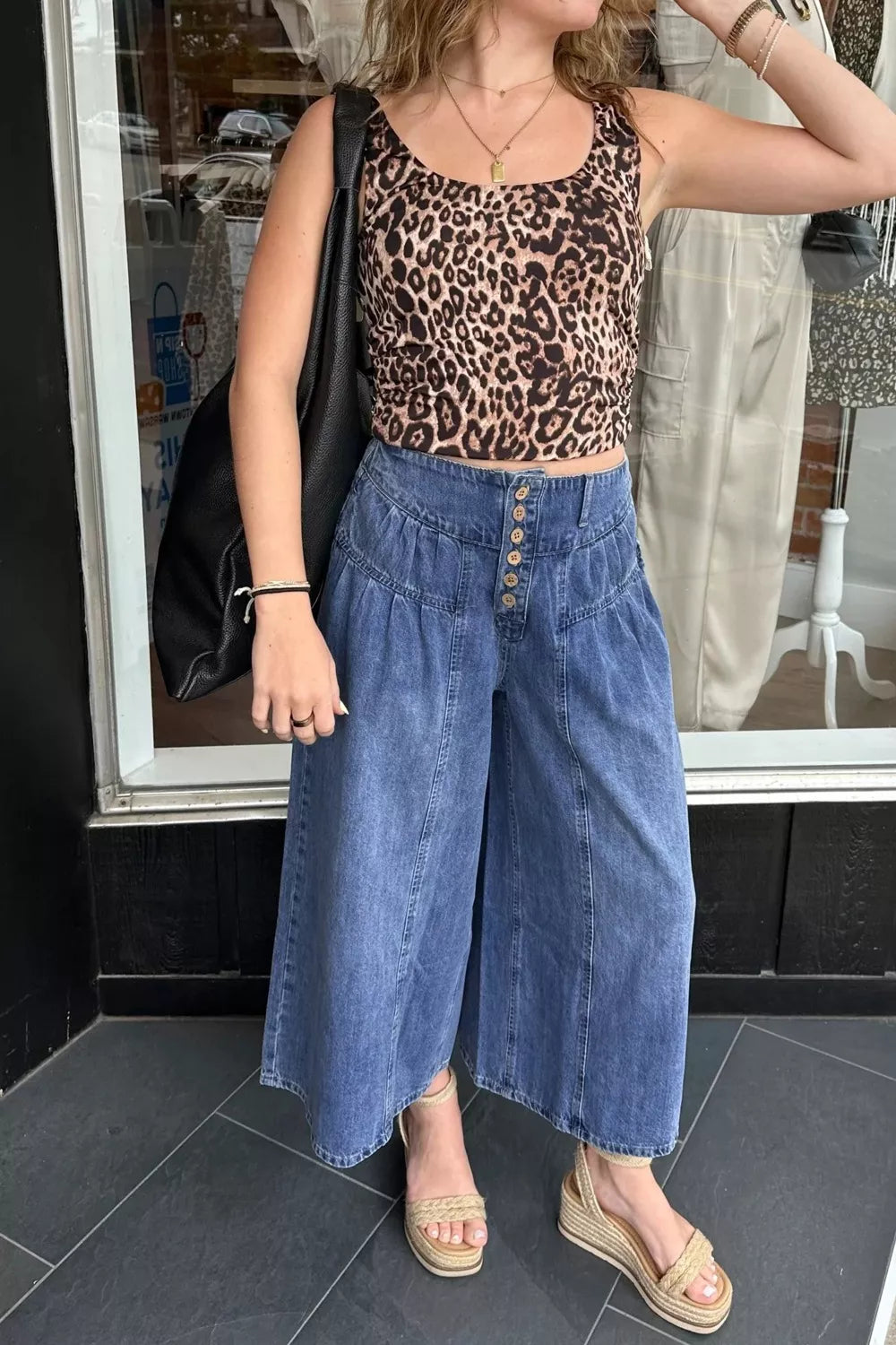 High-waisted wide-leg cotton denim jeans by Plush Fashion Hub with button fly, stylish and comfortable for casual wear.
