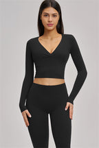 Fitglutes Activewear long sleeve crop top with fitted design, perfect for gym workouts and activewear activities.
