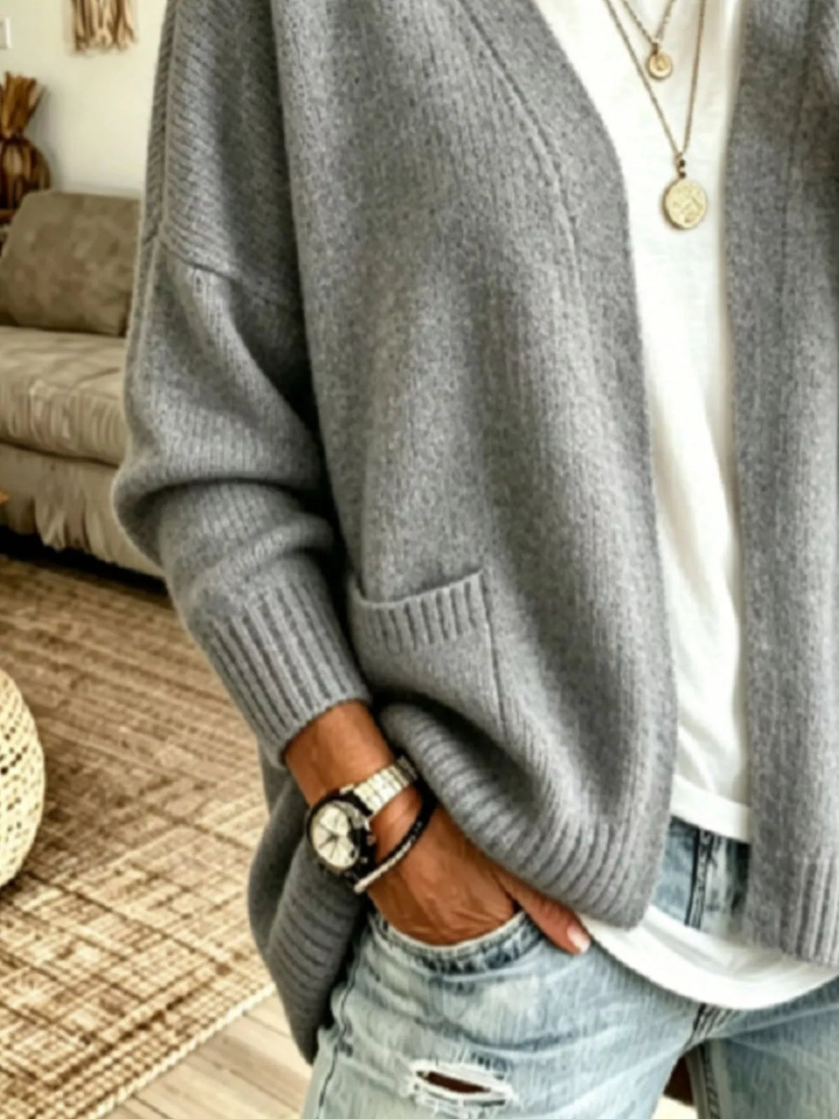 Open front knit cardigan with pockets from Trendsi, featuring a cozy, lightweight design perfect for casual layering.