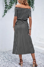 Off-shoulder tie-waist midi dress by Trendsi featuring a slit, perfect for stylish summer or evening wear.