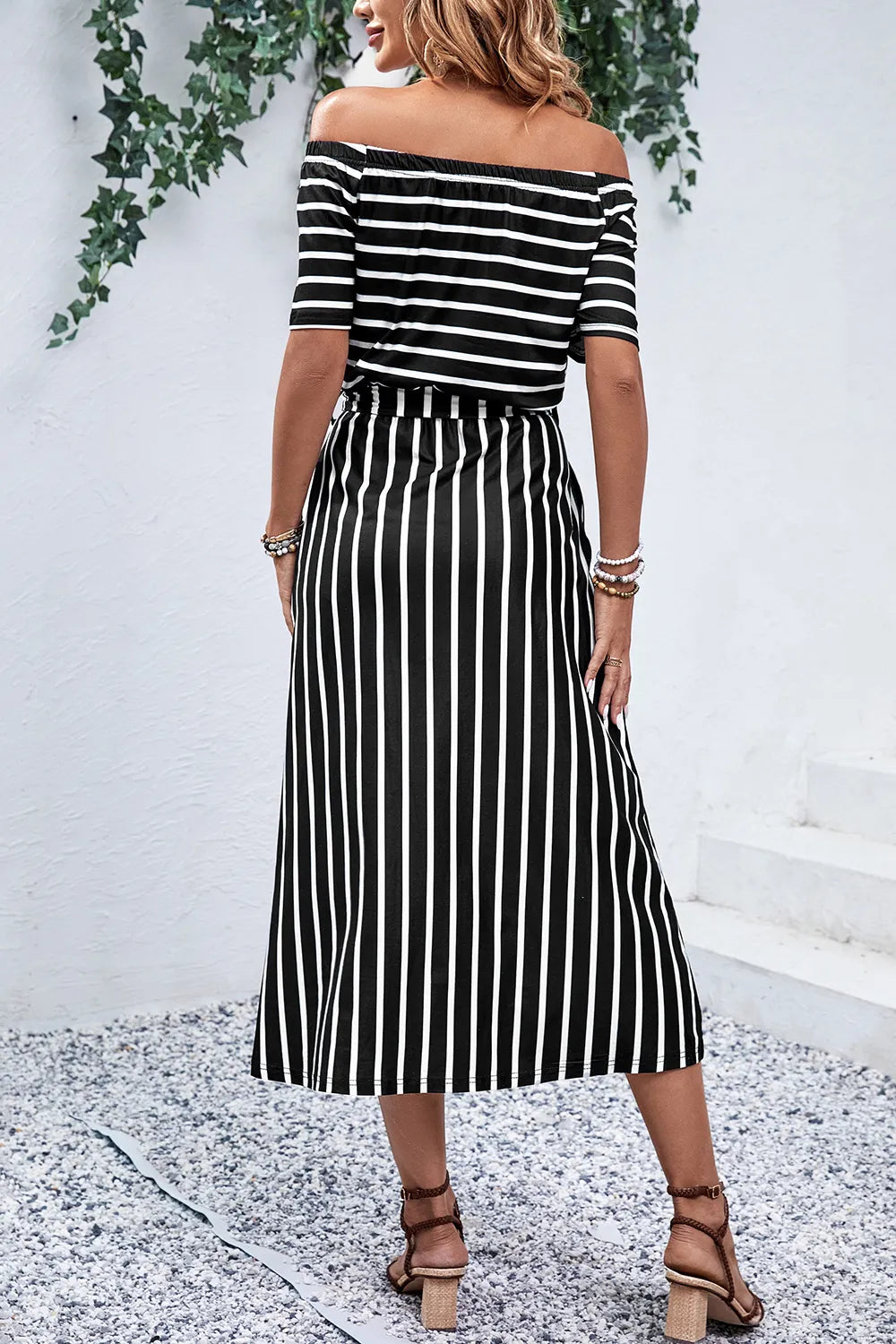 Off-shoulder tie-waist midi dress by Trendsi featuring a slit, perfect for stylish summer or evening wear.