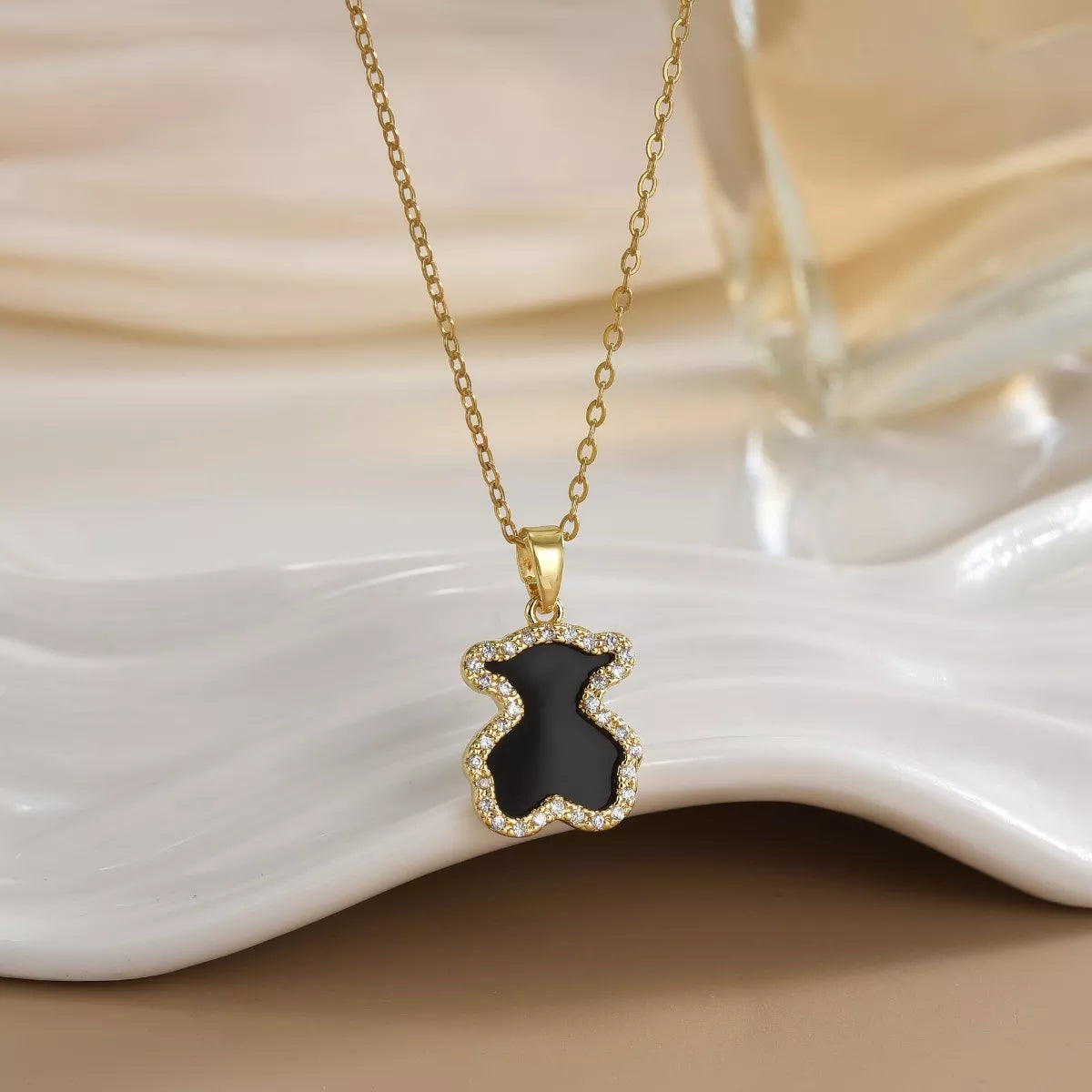 18K gold-plated bear pendant necklace from Shopimist featuring a detailed bear charm on a delicate chain.