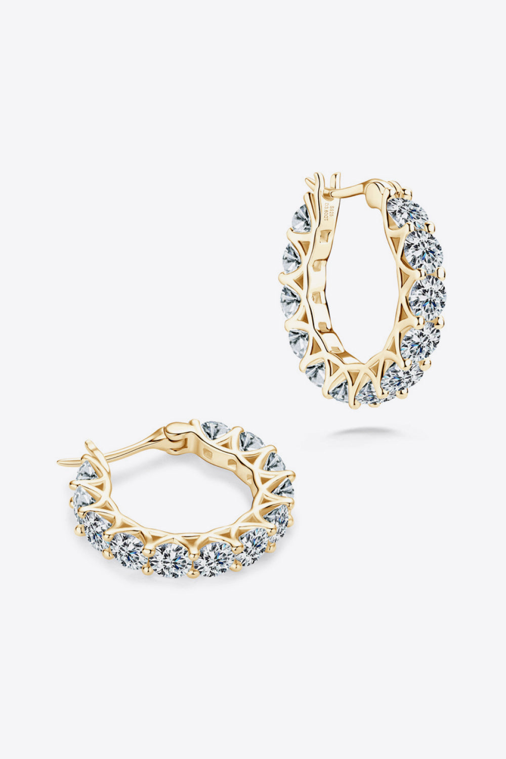 Sterling silver moissanite earrings with 7.2 carats, showcasing sparkling gemstones set in elegant silver hoops.