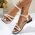 Pearl-embellished open toe low heel sandals for women, stylish and comfortable footwear by Trendsi.