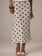 Women's polka dot midi skirt by Trendsi, vintage-inspired high-waisted A-line skirt with a classic pattern and flowing design.