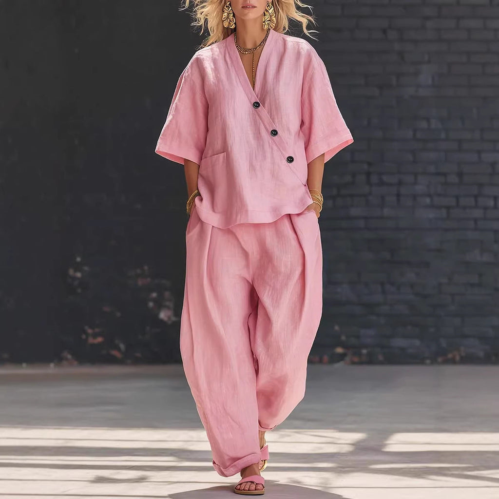 V-neck short sleeve top and high-waist trousers two-piece set from Plush Fashion Hub, stylish casual outfit on model.