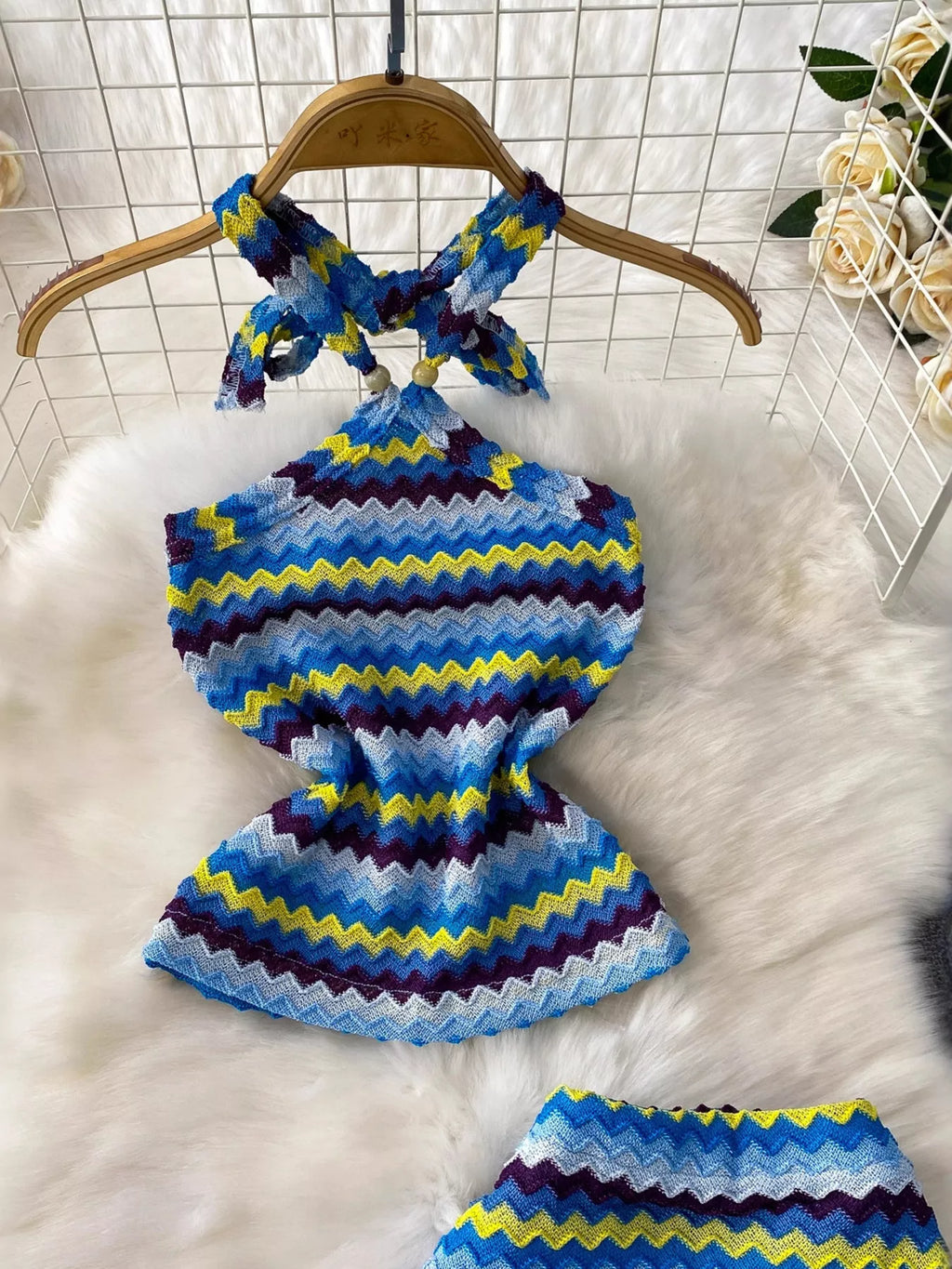 Women's striped knitted halter top and maxi skirt dress by Trendsi, featuring a stylish, comfortable knit design with bold stripes.
