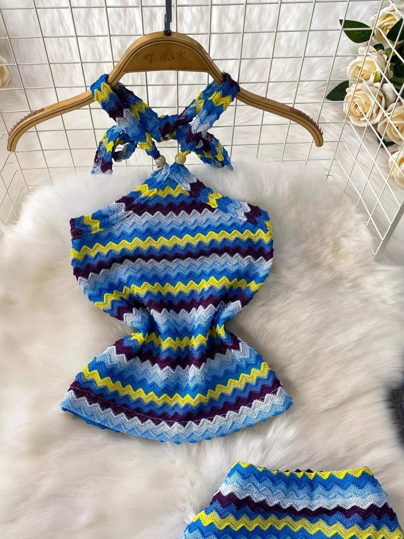 Women's striped knitted halter top and maxi skirt dress by Trendsi, featuring a stylish, comfortable knit design with bold stripes.