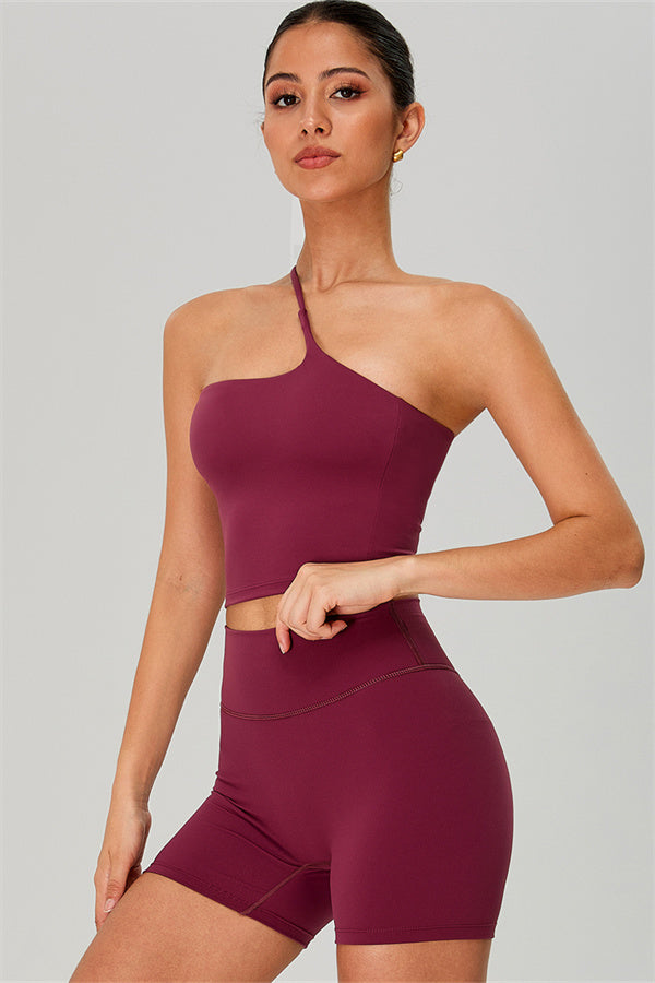 Fitglutes activewear one-shoulder crop top and shorts two-piece set, stylish gymwear and workout clothes for women.