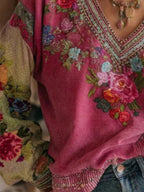 Floral embroidered V-neck blouse by Plush Fashion Hub, elegant plus size women's top with intricate embroidery and flowing fabric.