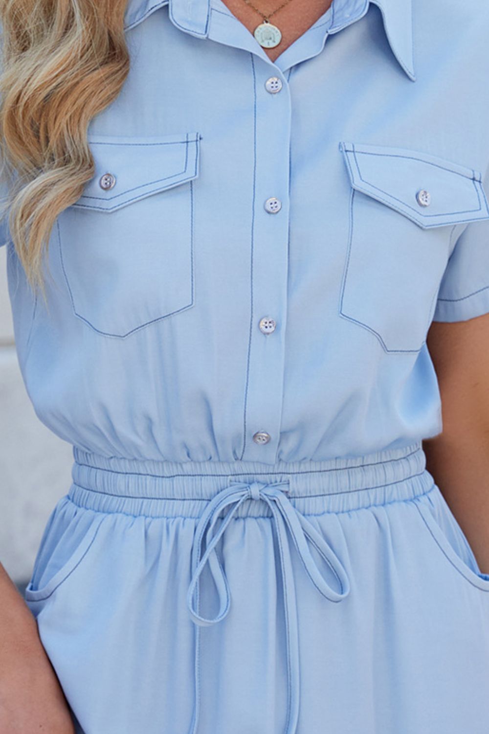 Short sleeve denim collared drawstring dress by Plush Fashion Hub, featuring a casual style with a front tie and button details.